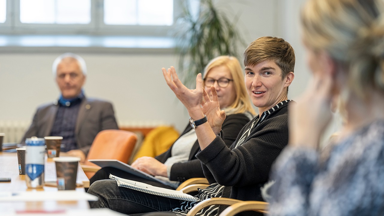 Fyra personer i en workshopsituation.